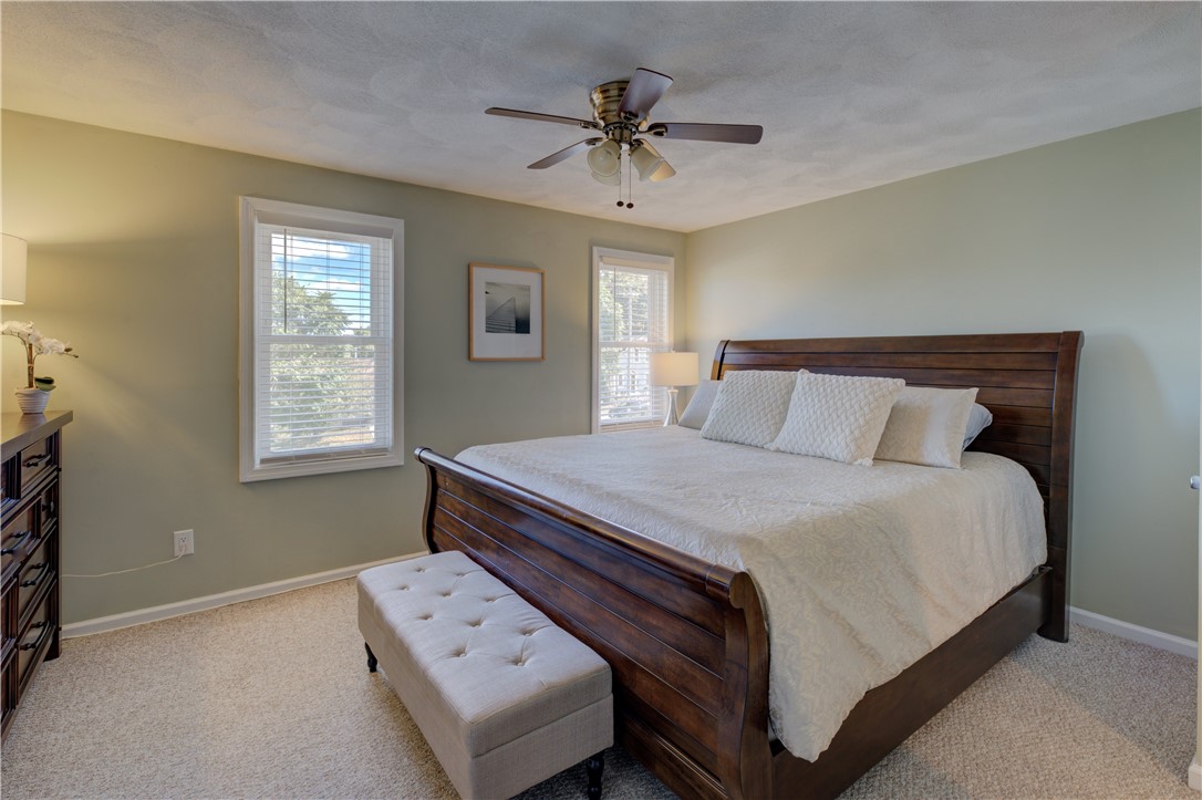 3399 Post Road, Unit 9 Warwick, RI 02886 - Photo 17 of 26 Large primary bedroom easily fits a King bed