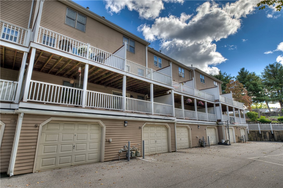 3399 Post Road, Unit 9 Warwick, RI 02886 - Photo 24 of 26 Huge garage that can fit two cars and storage. Deck is above the garage.