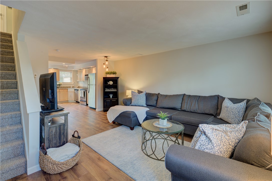 3399 Post Road, Unit 9 Warwick, RI 02886 - Photo 8 of 26 View into living room from the entry