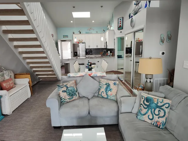 a kitchen with stainless steel appliances a refrigerator stove and microwave