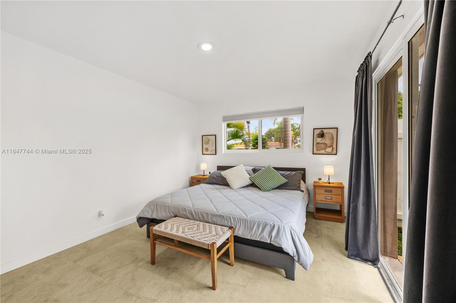 3246 Pierce Street Hollywood, FL 33021 - Photo 16 of 41 a bedroom with a bed and a window