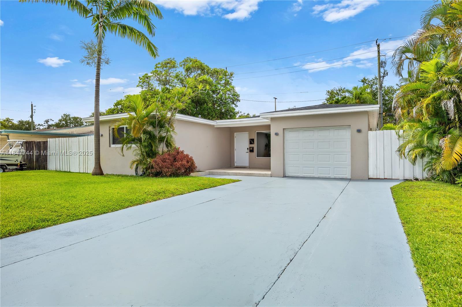 3246 Pierce Street Hollywood, FL 33021 - Photo 2 of 41 a house with garden in front of it