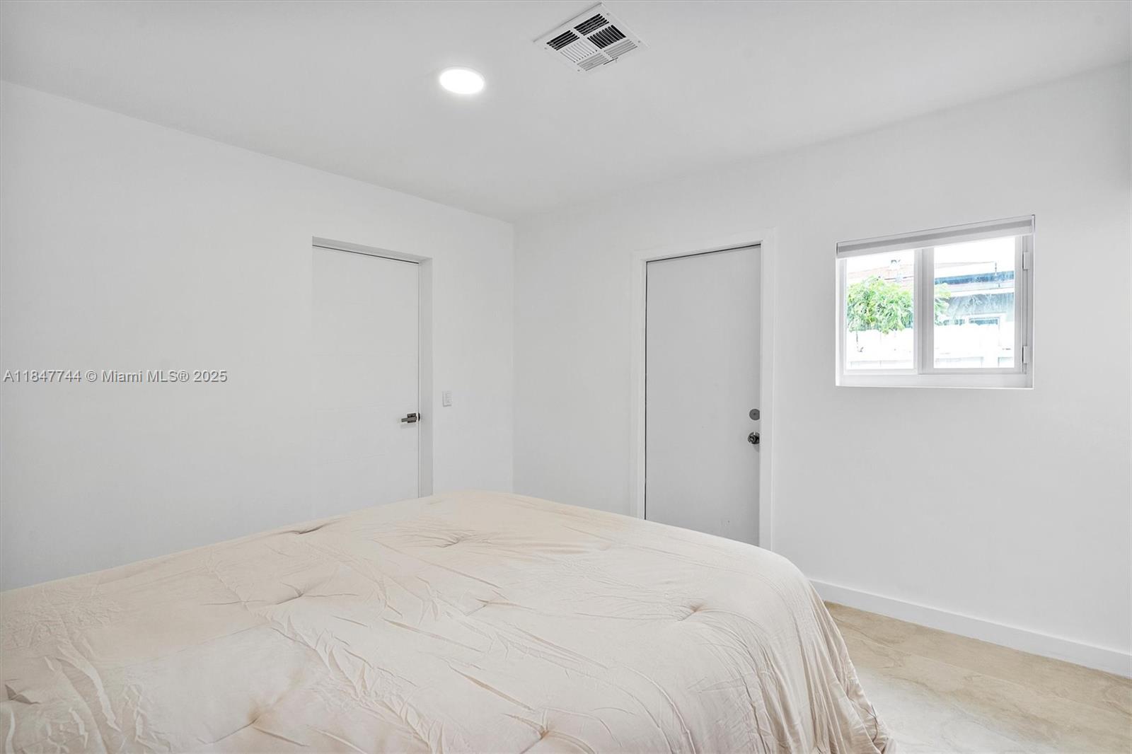 3246 Pierce Street Hollywood, FL 33021 - Photo 29 of 41 a bedroom with a bed and a window