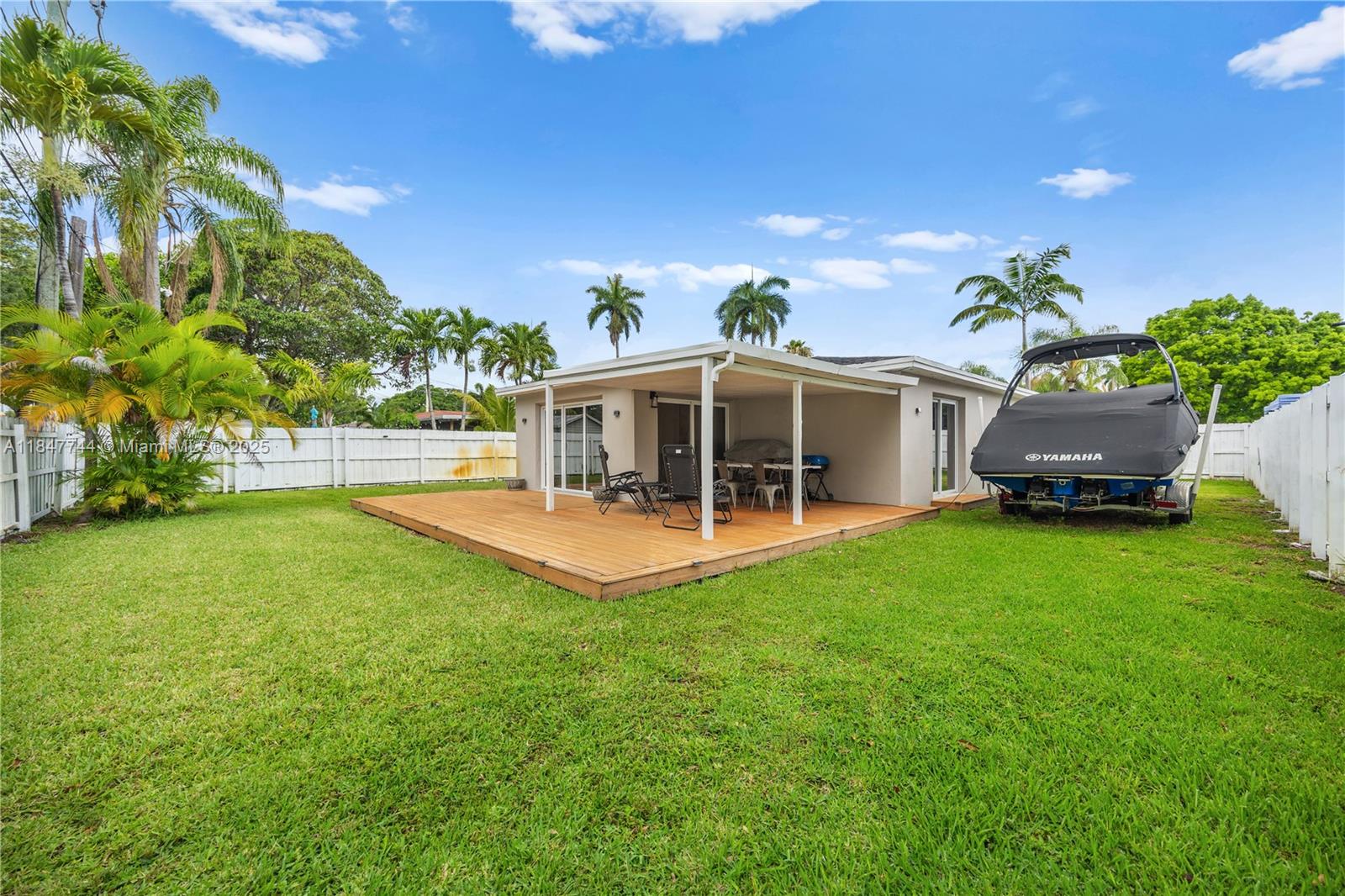 3246 Pierce Street Hollywood, FL 33021 - Photo 34 of 41 a view of a house with a backyard porch and sitting area