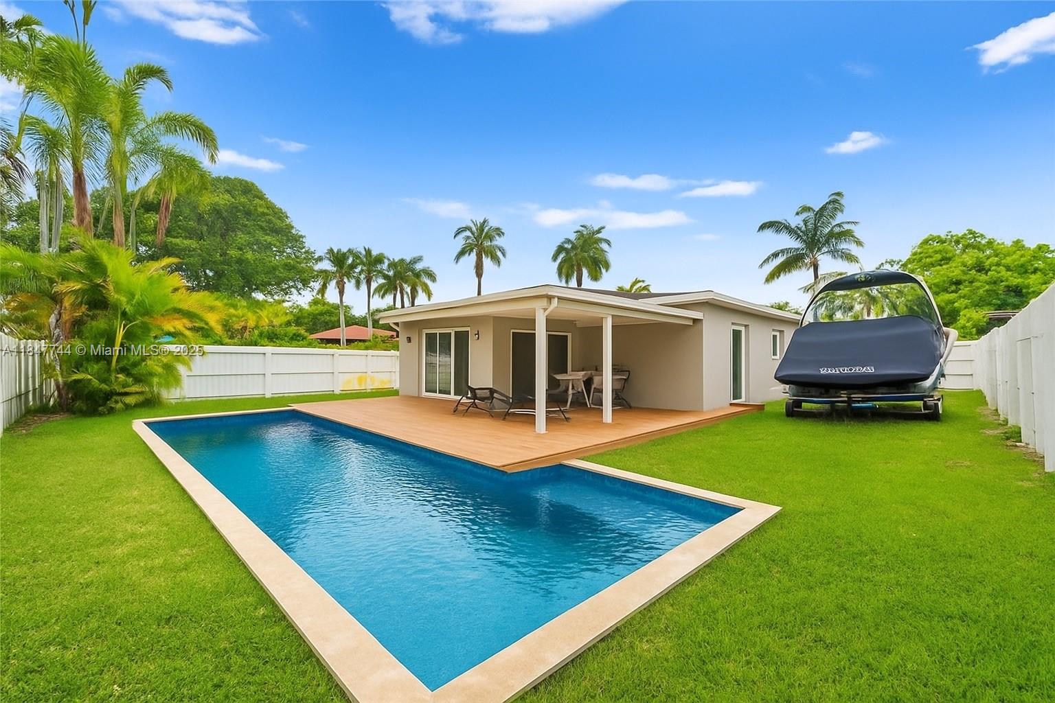 3246 Pierce Street Hollywood, FL 33021 - Photo 35 of 41 a view of a house with pool and a yard