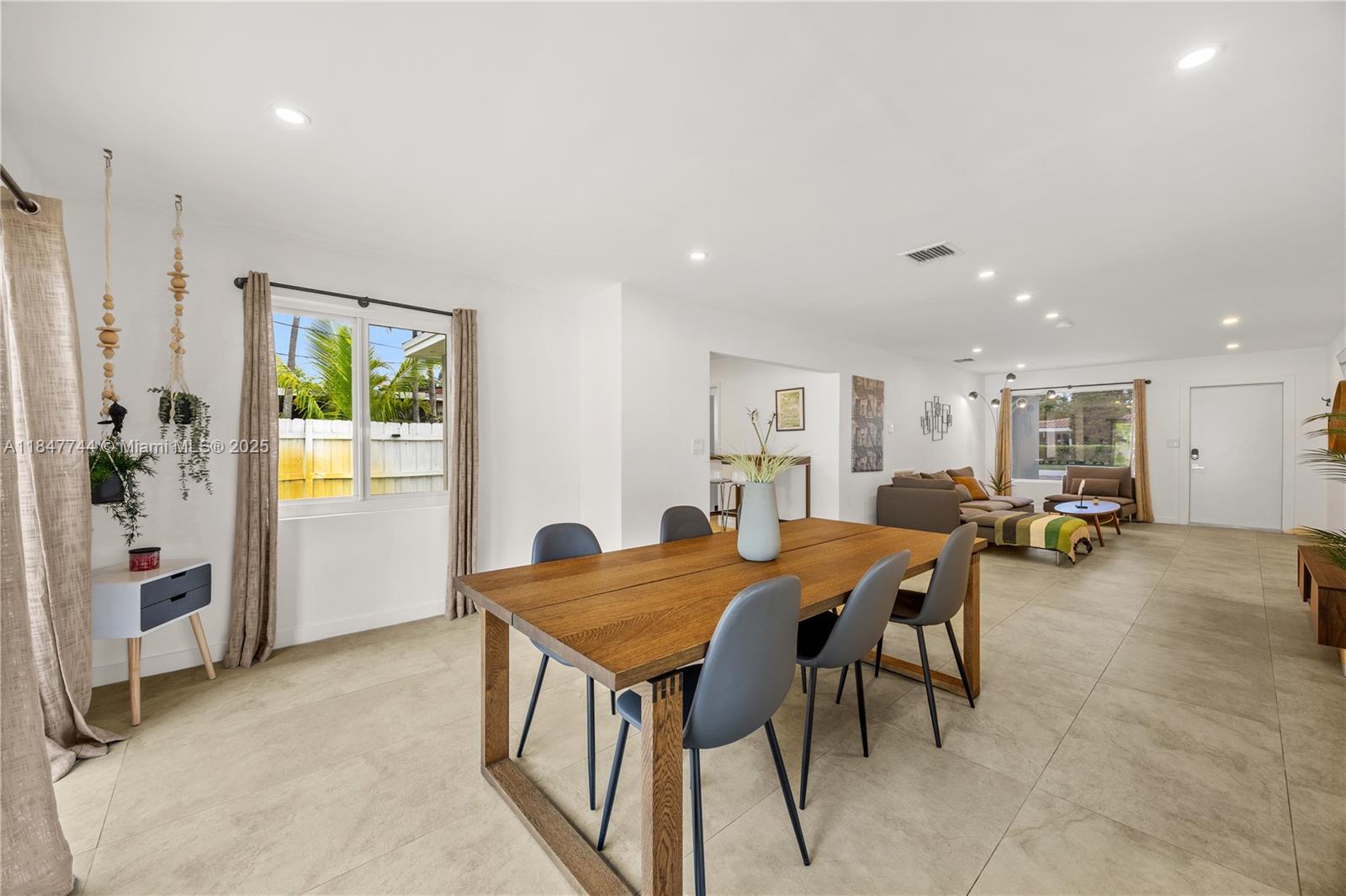 3246 Pierce Street Hollywood, FL 33021 - Photo 7 of 41 a view of a dining room with furniture and a livingroom