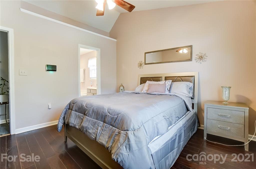 7034 Blithe Low Place Charlotte, NC 28273 - Photo 16 of 31 a bedroom with a bed and a window
