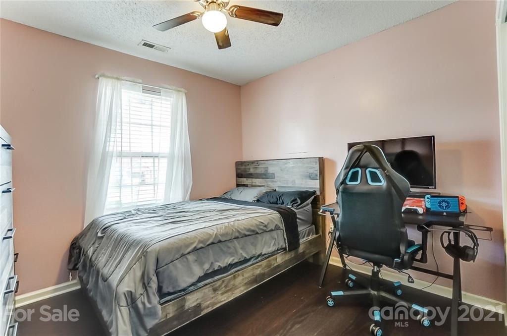 7034 Blithe Low Place Charlotte, NC 28273 - Photo 20 of 31 a bedroom with a bed and a window