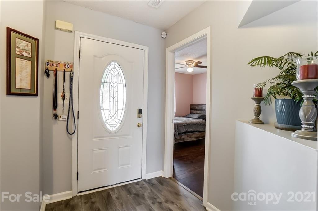 7034 Blithe Low Place Charlotte, NC 28273 - Photo 5 of 31 a view of hallway with livingroom and furniture