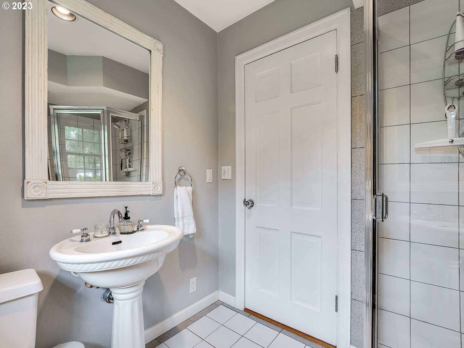 2828 Southwest Sunset Boulevard Portland, OR 97239 - Photo 16 of 32 a bathroom with a sink a toilet and shower