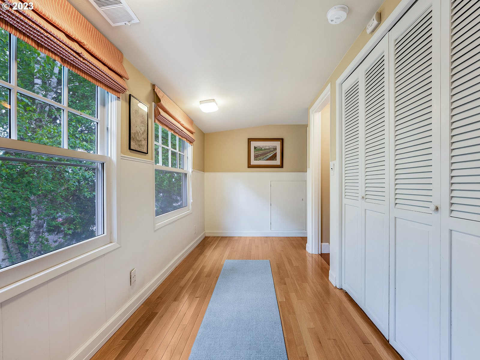 2828 Southwest Sunset Boulevard Portland, OR 97239 - Photo 20 of 32 a view of a hallway with wooden floor and staircase