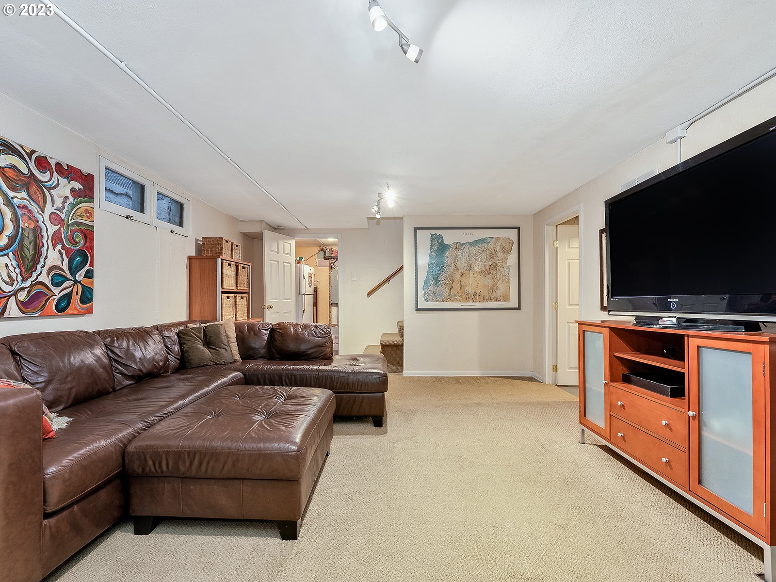 2828 Southwest Sunset Boulevard Portland, OR 97239 - Photo 23 of 32 a living room with furniture and a flat screen tv