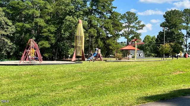 a view of a swimming pool with a yard