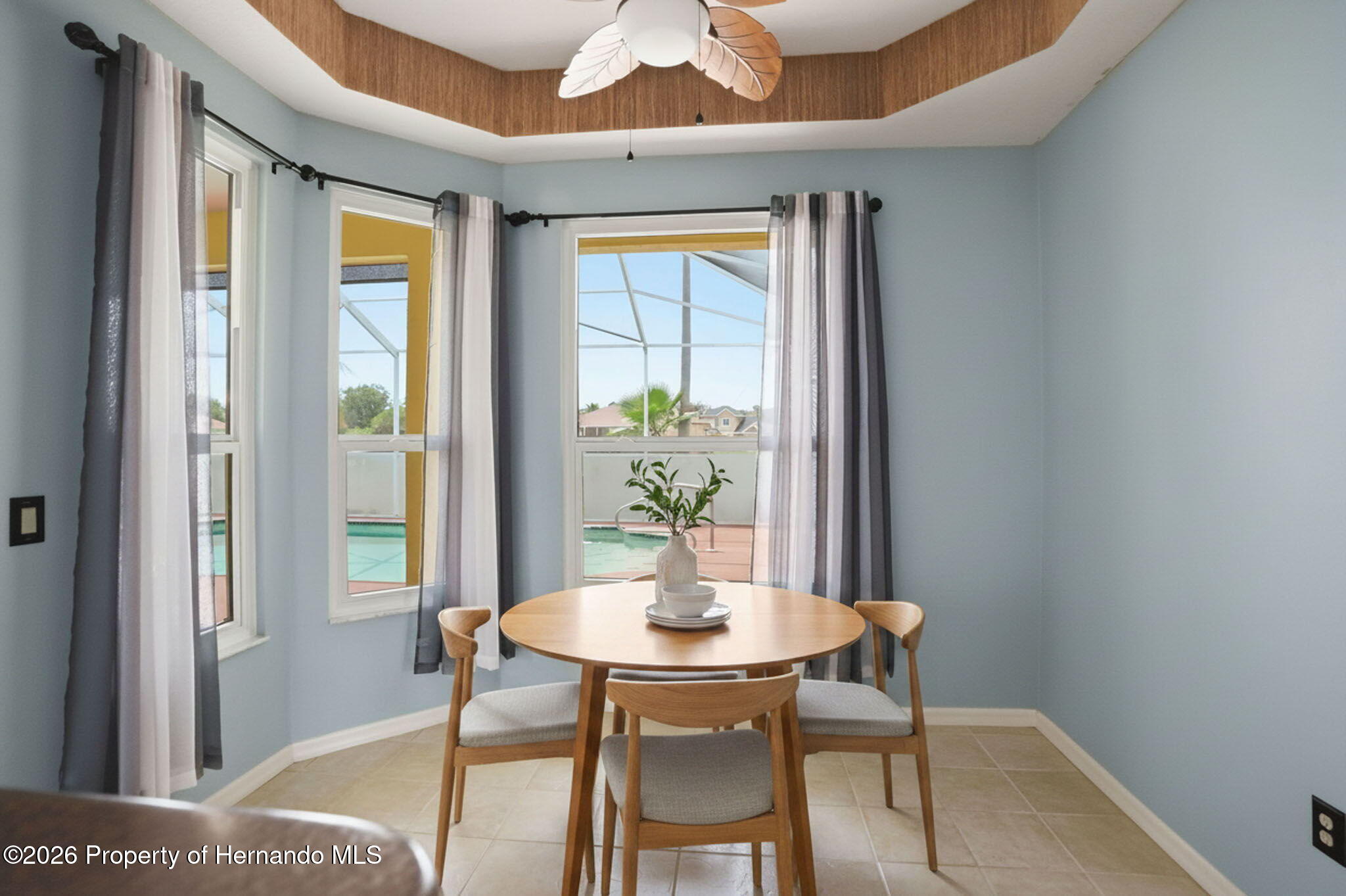 18131 Rivard Boulevard Brooksville, FL 34604 - Photo 20 of 66 a view of a dining room with furniture window and wooden floor