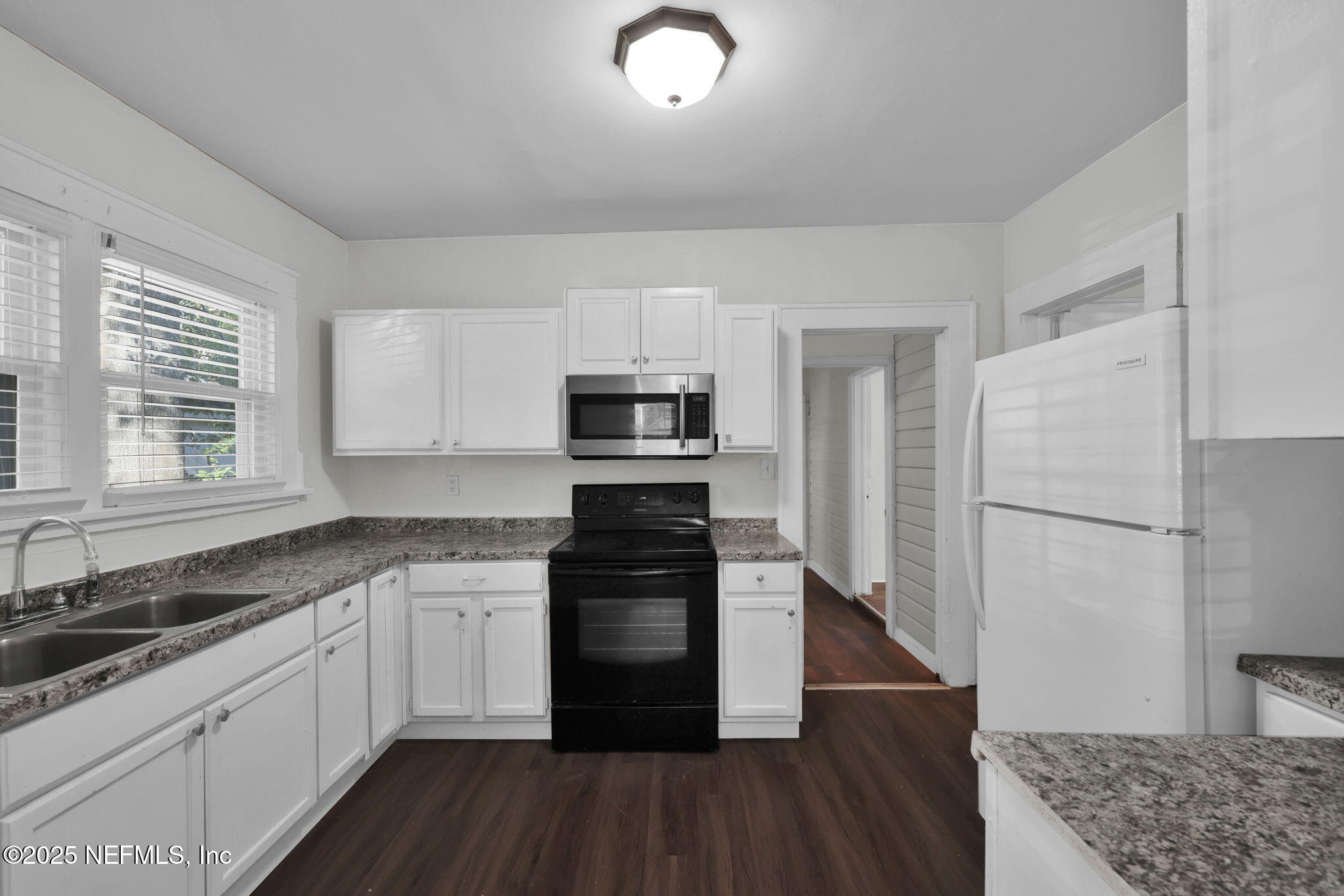 2915 Fitzgerald Street Jacksonville, FL 32254 - Photo 11 of 32 a kitchen with granite countertop a refrigerator and a stove top oven
