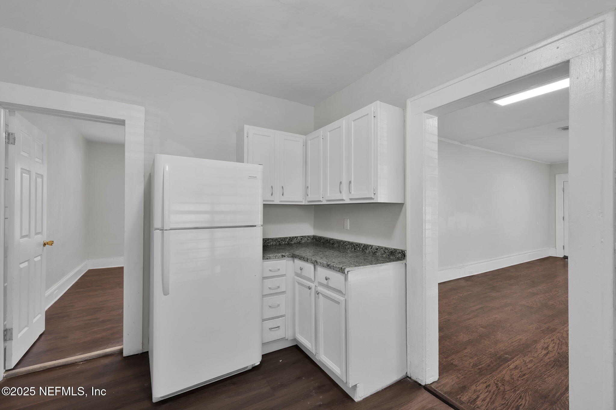 2915 Fitzgerald Street Jacksonville, FL 32254 - Photo 13 of 32 a kitchen with white cabinets and white appliances