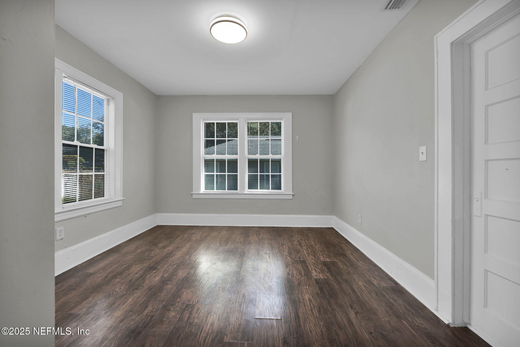 2915 Fitzgerald Street Jacksonville, FL 32254 - Photo 18 of 32 an empty room with wooden floor and windows