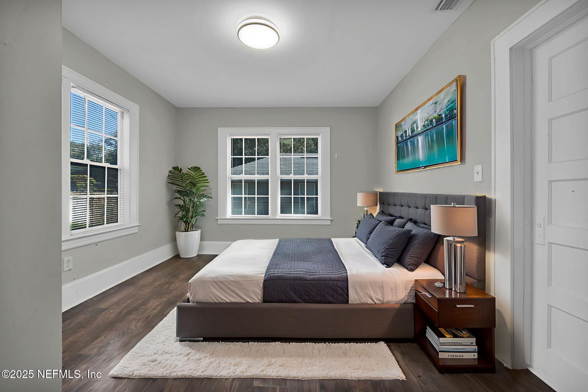 2915 Fitzgerald Street Jacksonville, FL 32254 - Photo 19 of 32 a bedroom with a bed and glass window