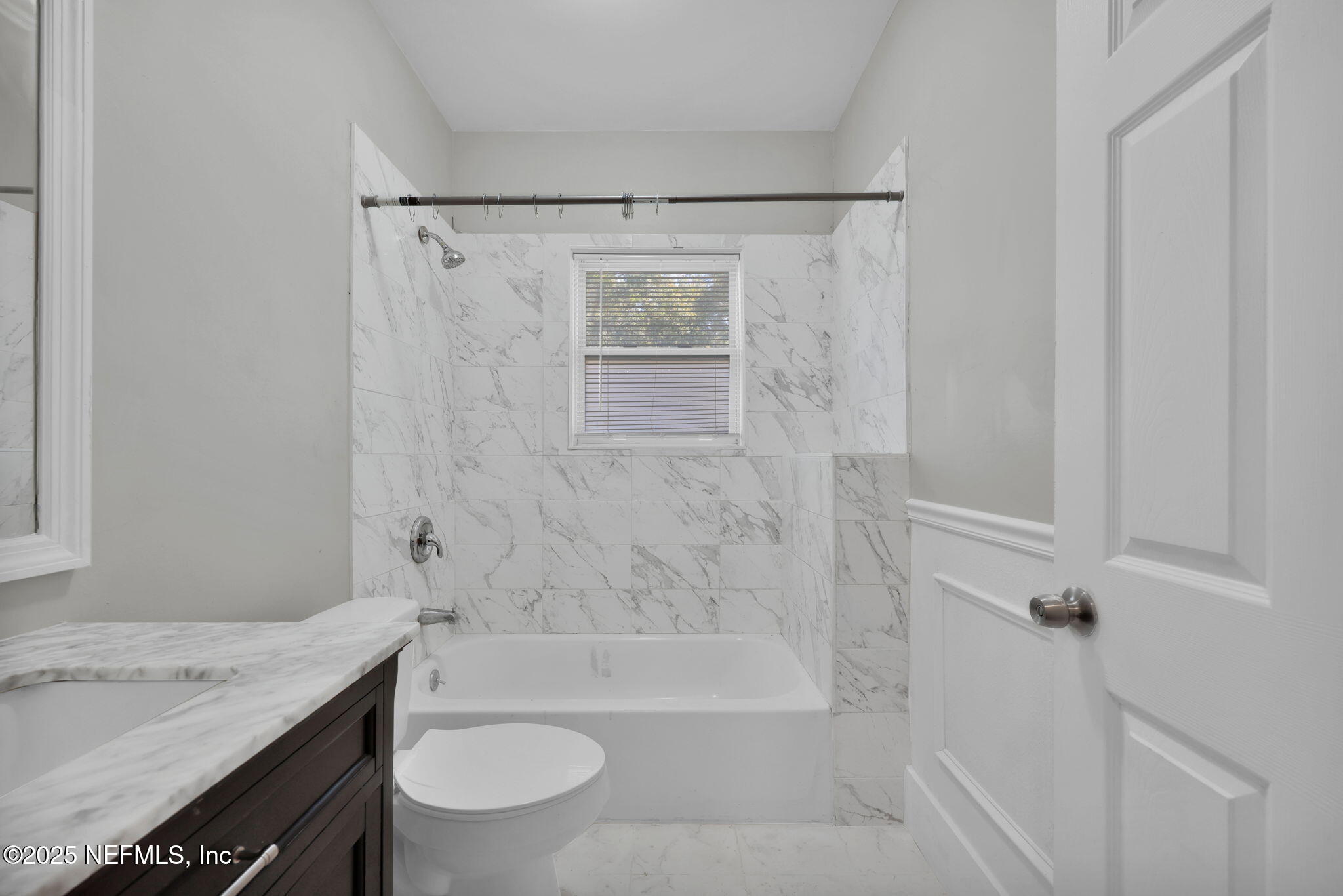 2915 Fitzgerald Street Jacksonville, FL 32254 - Photo 22 of 32 a bathroom with a granite countertop sink toilet and shower