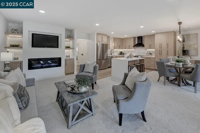 a living room with fireplace furniture and a flat screen tv
