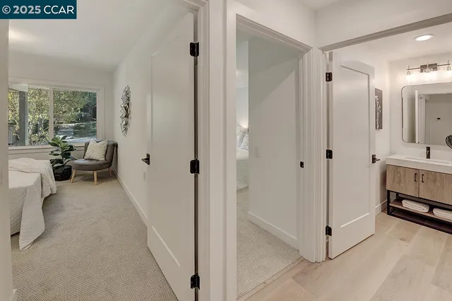 a view of a bedroom with tub and window