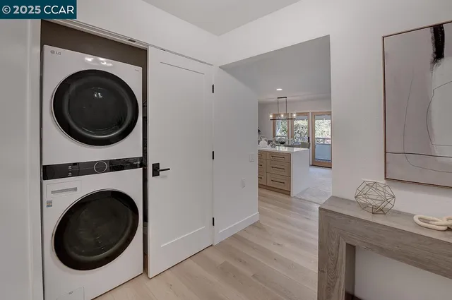 a view of a kitchen with a washer and dryer