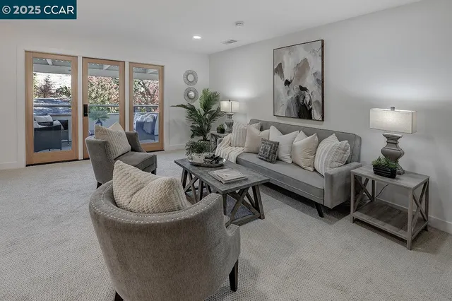 a living room with furniture and a large window