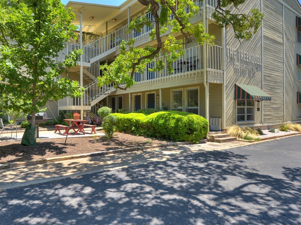 202 East 45th Street, Unit 203 Austin, TX 78751 - Photo 13 of 20 a view of a house with a garden and pathway