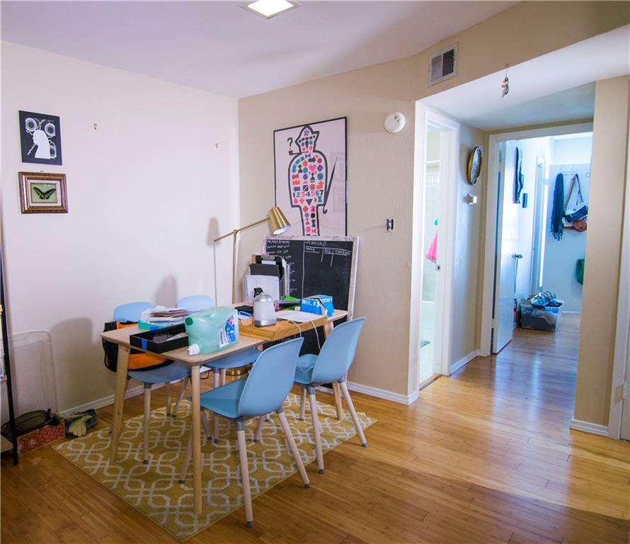 202 East 45th Street, Unit 203 Austin, TX 78751 - Photo 3 of 20 a workspace with furniture and wooden floor
