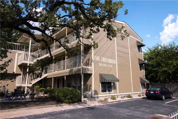 a view of a building with a street