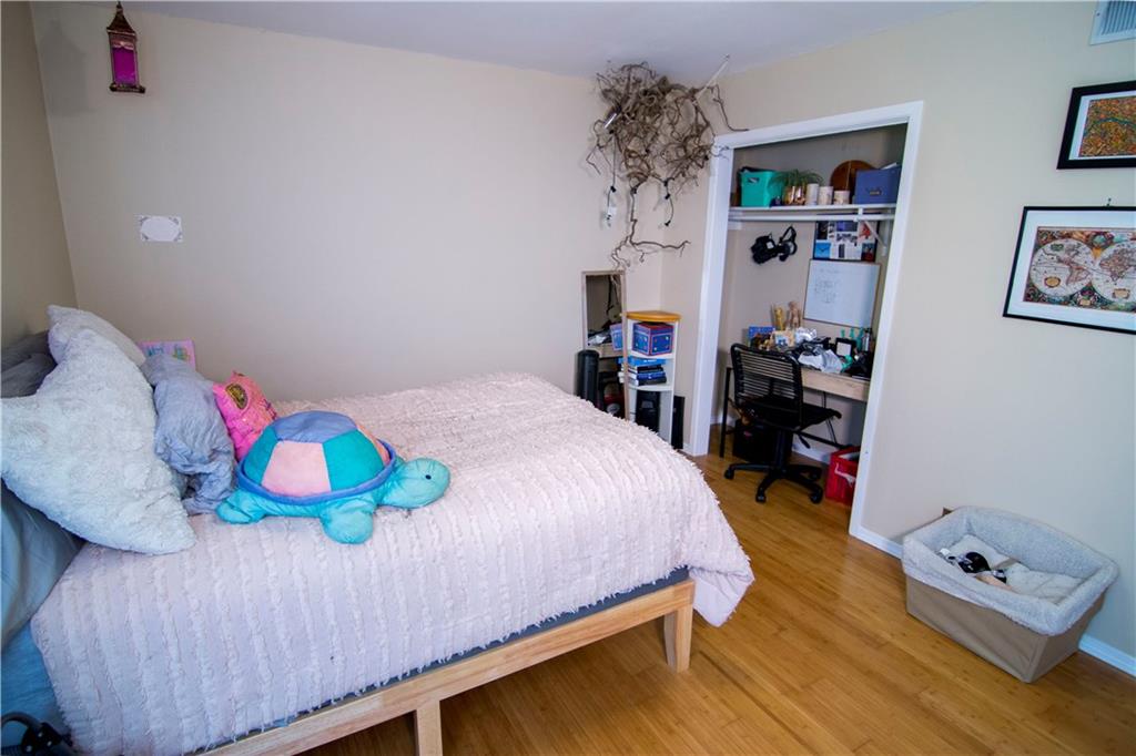 202 East 45th Street, Unit 203 Austin, TX 78751 - Photo 9 of 20 a bedroom with a bed and dresser