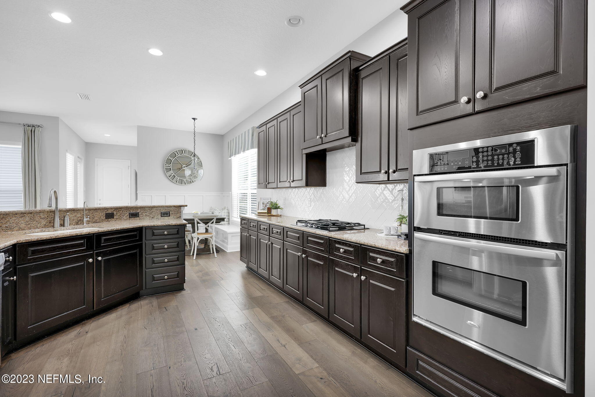 141 Pelican Pointe Road Ponte Vedra, FL 32081 - Photo 15 of 80 a kitchen with stainless steel appliances granite countertop a stove top oven microwave and cabinets