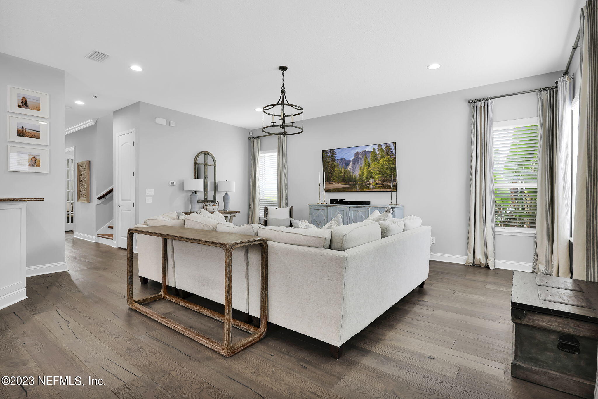 141 Pelican Pointe Road Ponte Vedra, FL 32081 - Photo 18 of 80 a living room with furniture and a chandelier