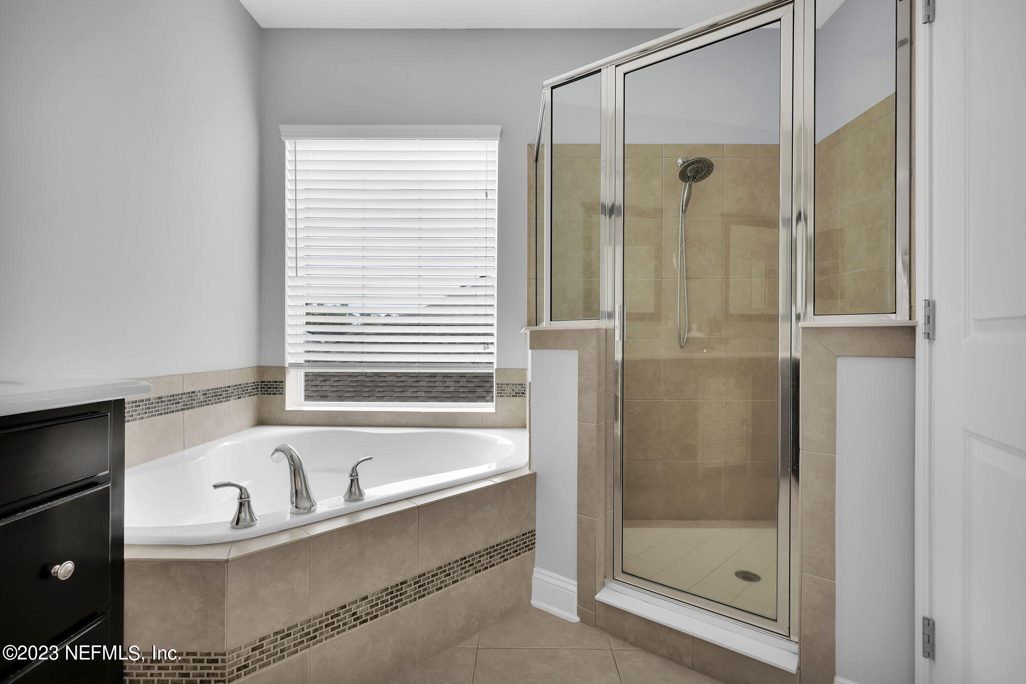 141 Pelican Pointe Road Ponte Vedra, FL 32081 - Photo 28 of 80 a bathroom with a bathtub and a shower