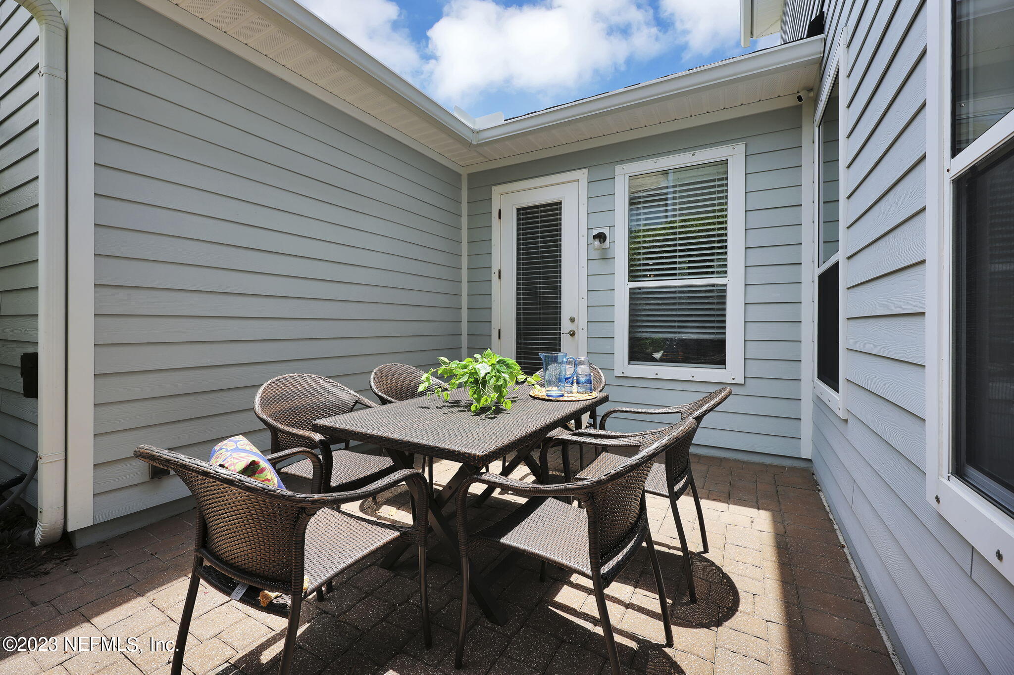 141 Pelican Pointe Road Ponte Vedra, FL 32081 - Photo 33 of 80 a backyard of a house with table and chairs