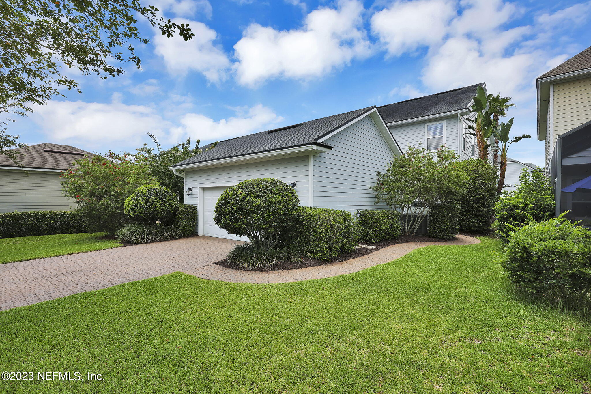 141 Pelican Pointe Road Ponte Vedra, FL 32081 - Photo 35 of 80 a view of a house with a yard and potted plants