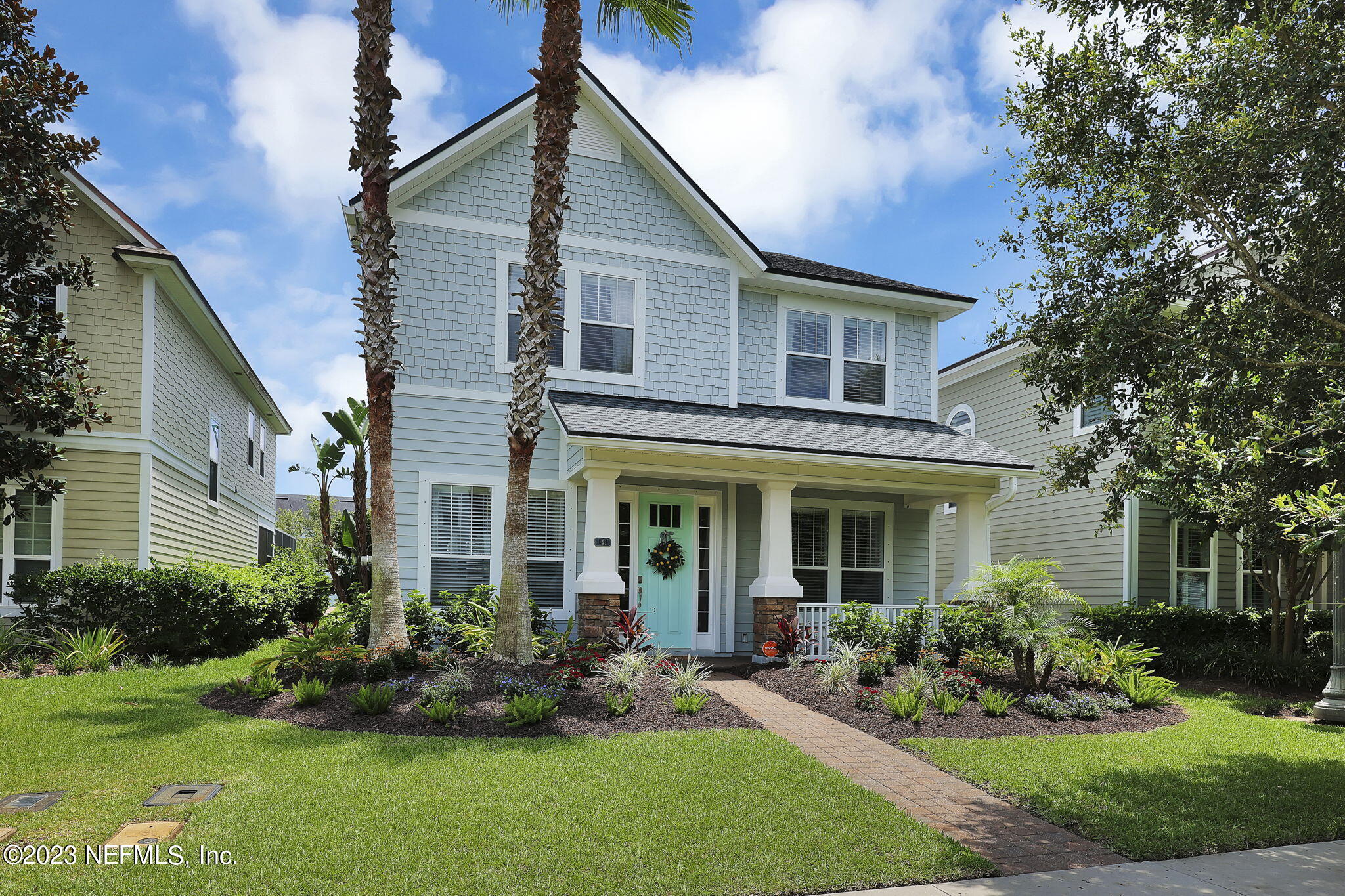 141 Pelican Pointe Road Ponte Vedra, FL 32081 - Photo 4 of 80 a front view of a house with a yard and porch