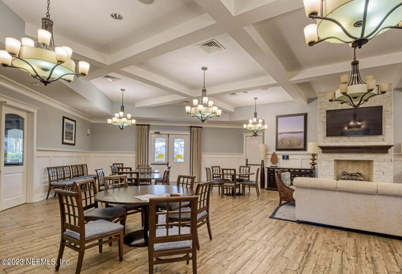 141 Pelican Pointe Road Ponte Vedra, FL 32081 - Photo 42 of 80 a view of a dining room with furniture wooden floor and chandelier