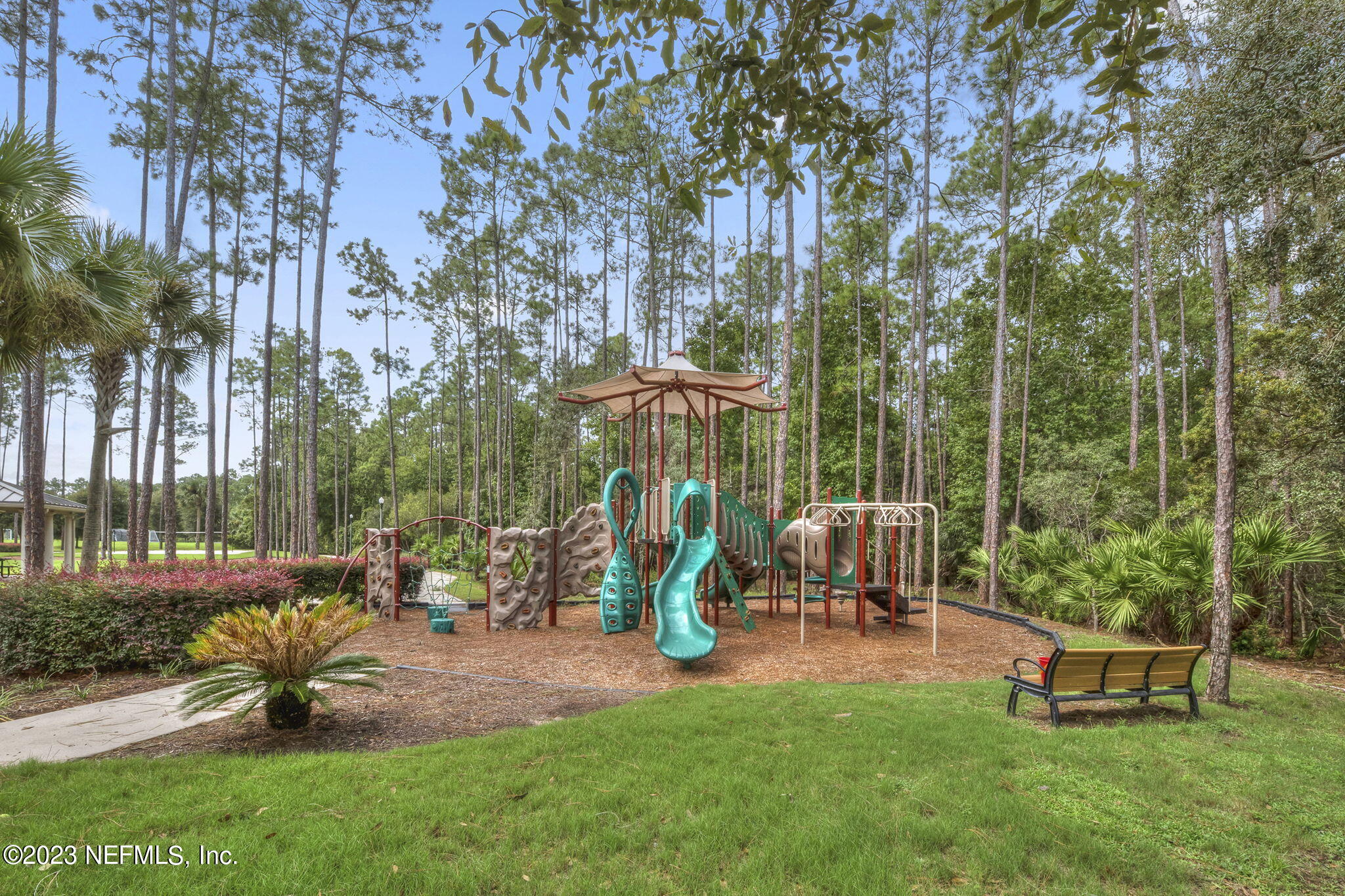 141 Pelican Pointe Road Ponte Vedra, FL 32081 - Photo 51 of 80 a view of a park with bench and a slide