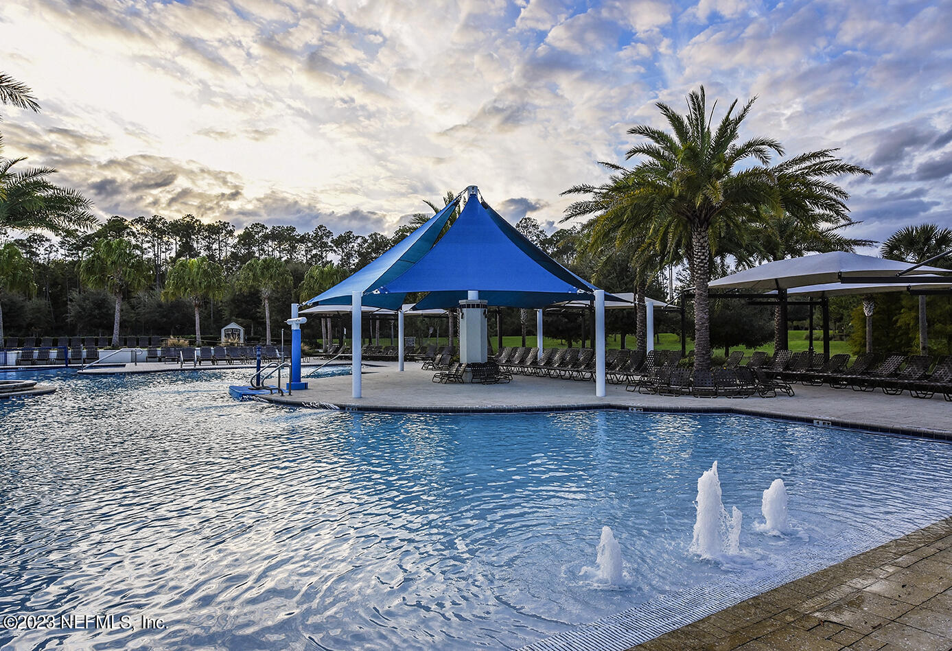 141 Pelican Pointe Road Ponte Vedra, FL 32081 - Photo 63 of 80 a house with swimming pool in front of it