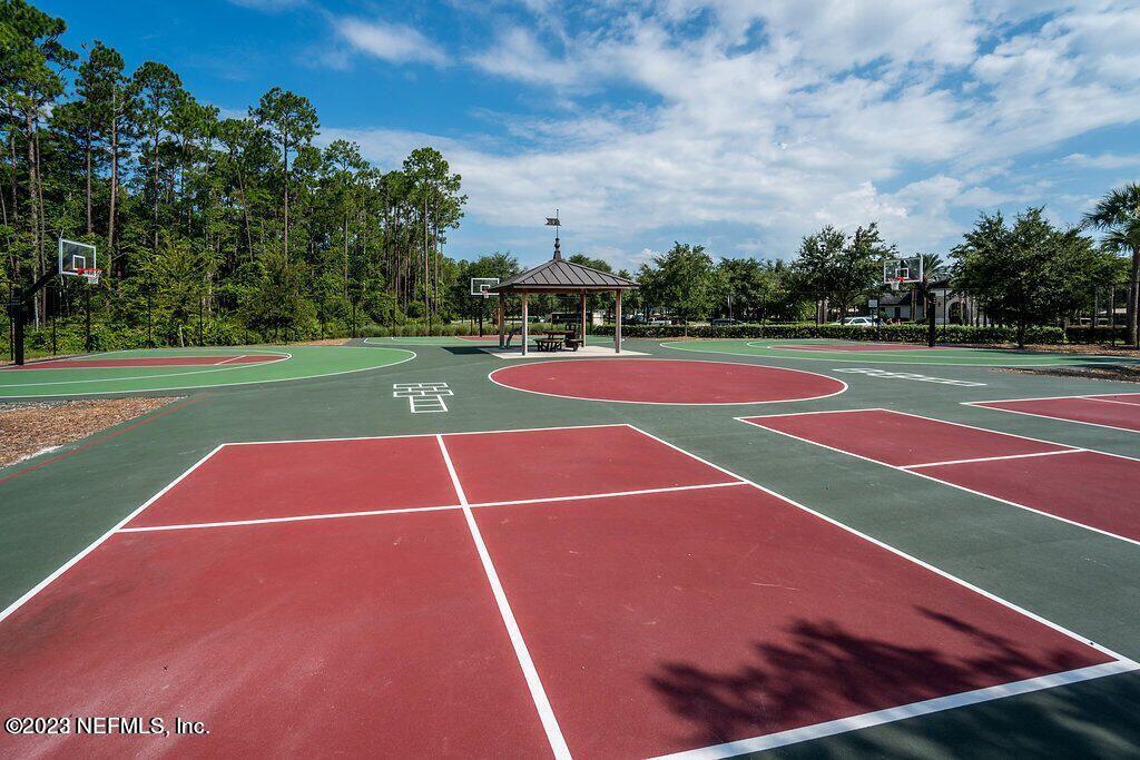141 Pelican Pointe Road Ponte Vedra, FL 32081 - Photo 72 of 80 a view of tennis court with trees in the background