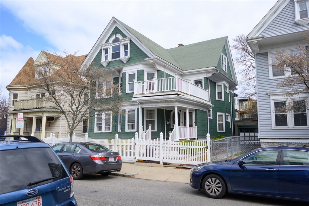 a front view of a house with parking space