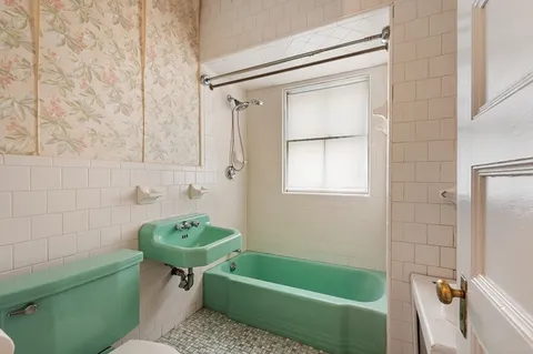 a bathroom with a sink toilet and bathtub