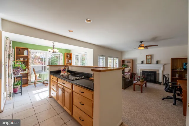 a view of a dining room with furniture large windows and wooden floor
