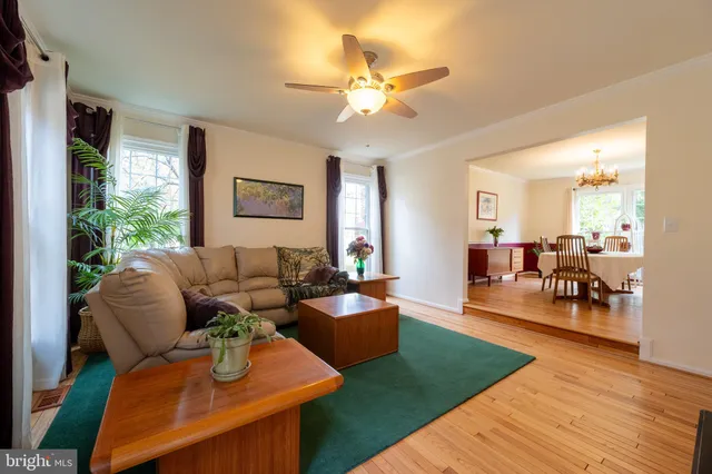 a spacious bedroom with a bed and a chandelier