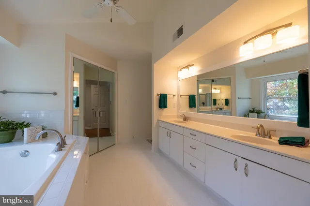 a view of a workspace with furniture and wooden floor