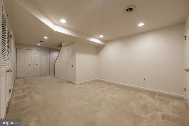 a view of a yard with wooden fence