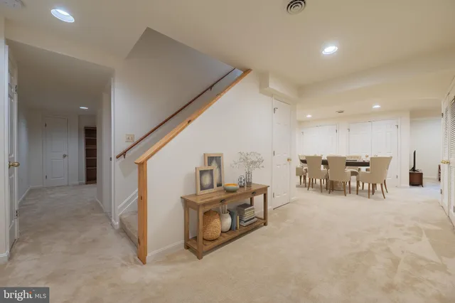 a view of deck with a table and chairs and wooden floor