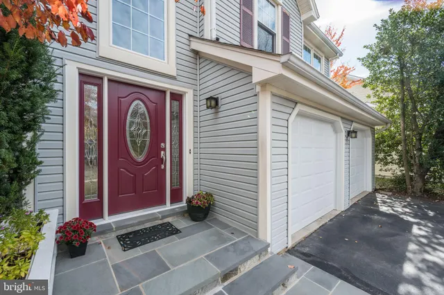 a kitchen with stainless steel appliances granite countertop a refrigerator a stove a sink and a refrigerator