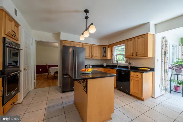 a kitchen with a table and chairs in it